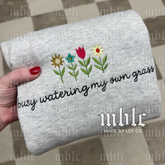 Busy watering my own Grass Shirt - Embroidered
